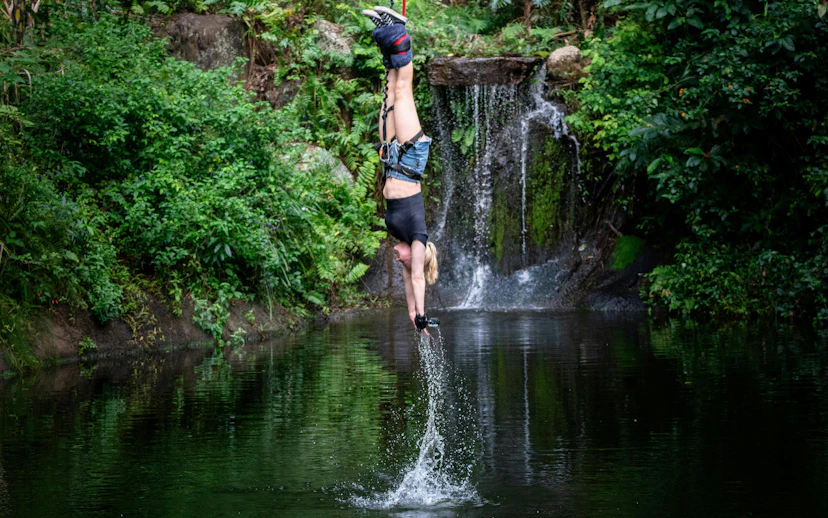 Visitor bungy jumping with water touch at Skypark Cairns.