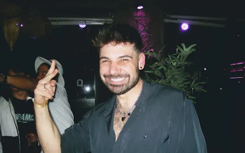 Man enjoying a night out during a Barcelona solo travelers bar crawl.