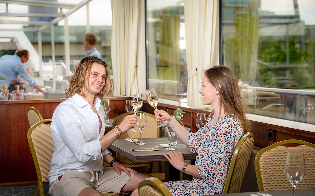 Couple enjoying a toast on a Wachau Valley cruise from Vienna.