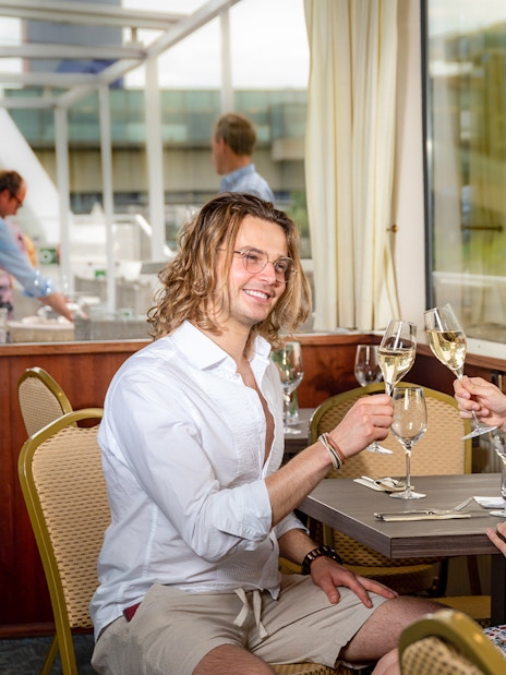 Couple enjoying a toast on a Wachau Valley cruise from Vienna.