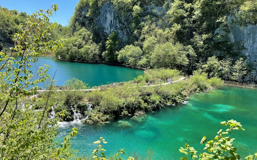 Plitvice Lakes National Park turquoise lake and lush greenery, Croatia.