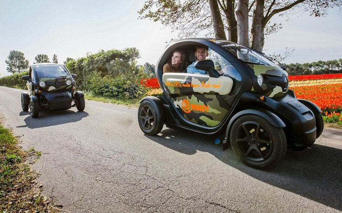Electric cars on a self-drive audio tour through Keukenhof tulip fields.