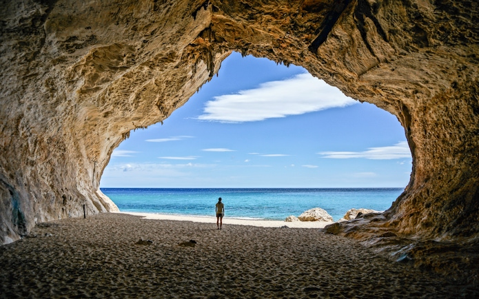 Cave opening view of Cala Luna beach, Gulf of Orosei, Dorgali, Sardinia, Italy.
