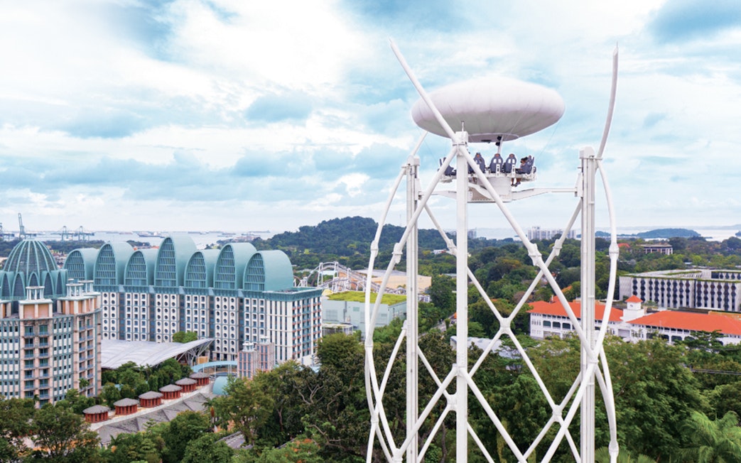 Singapore skyline view from cable car ride with Sentosa Island attractions.