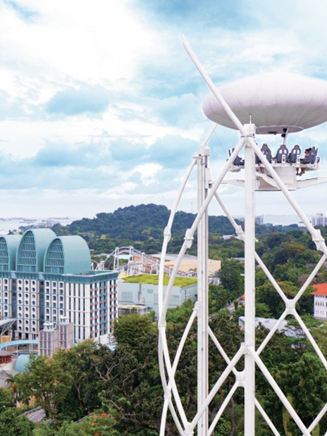Singapore skyline view from cable car ride with Sentosa Island attractions.