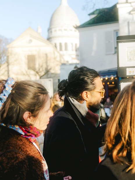 People viewing art on Montmartre Walking Tour in Paris.