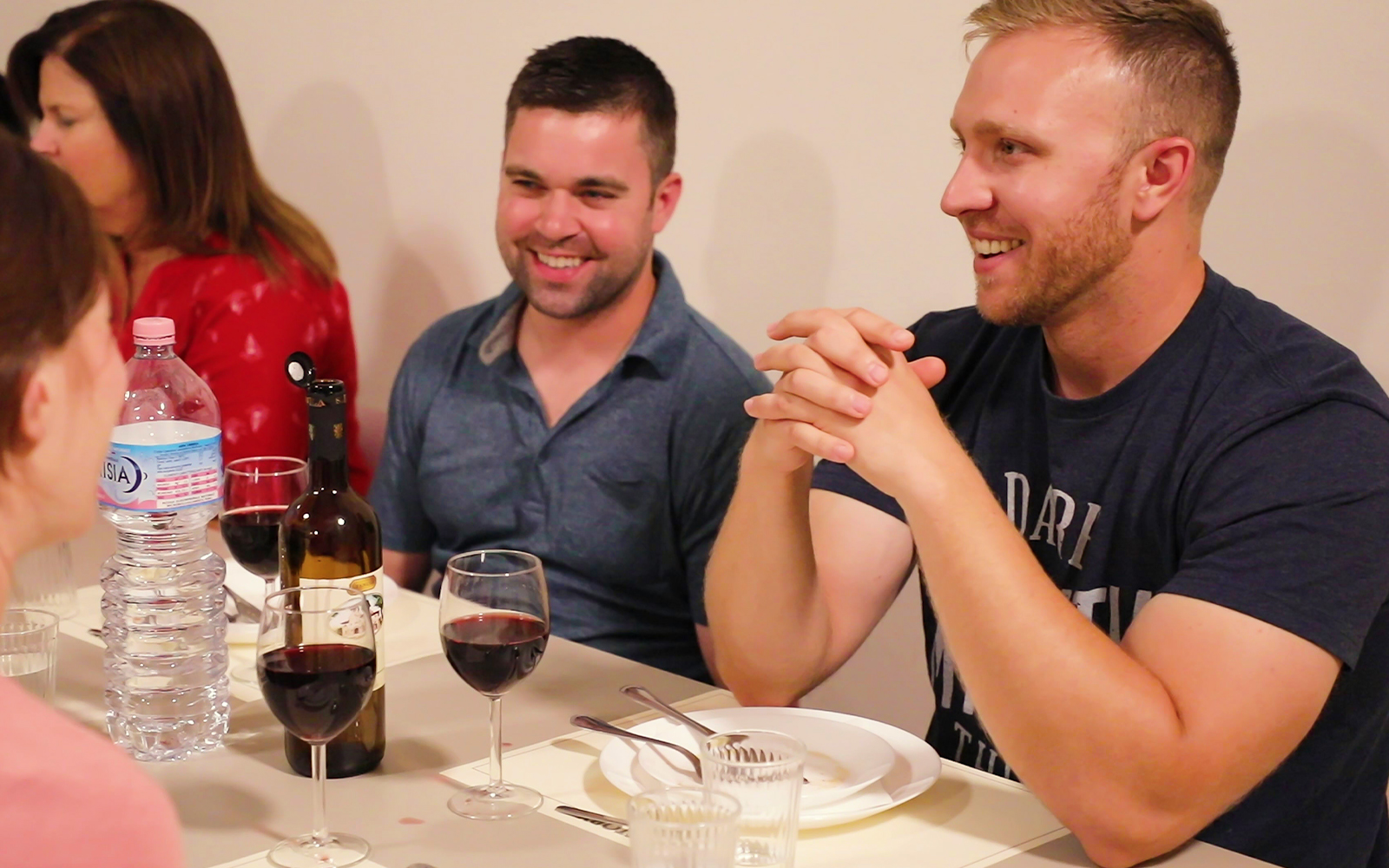 Participants enjoying a meal during a cooking class in Florence.