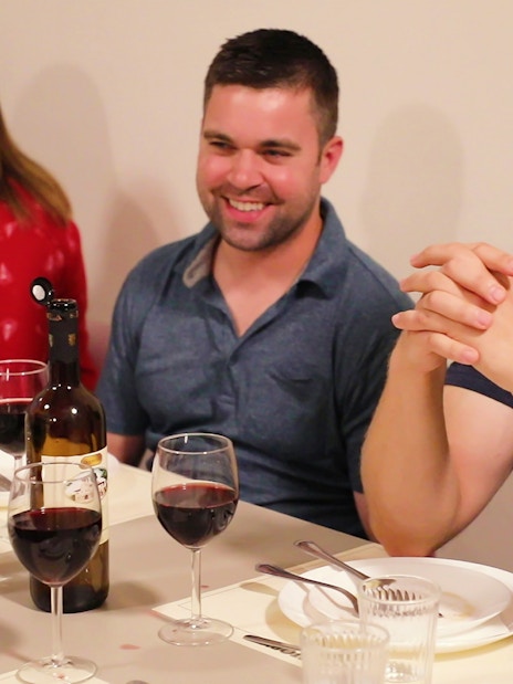 Participants enjoying a meal during a cooking class in Florence.