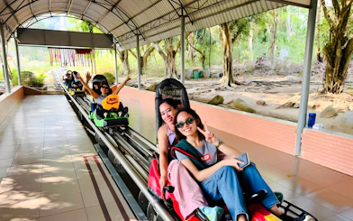 Tourists on a roller coaster at Black Virgin Mountain, Tay Ninh, near Ho Chi Minh City.