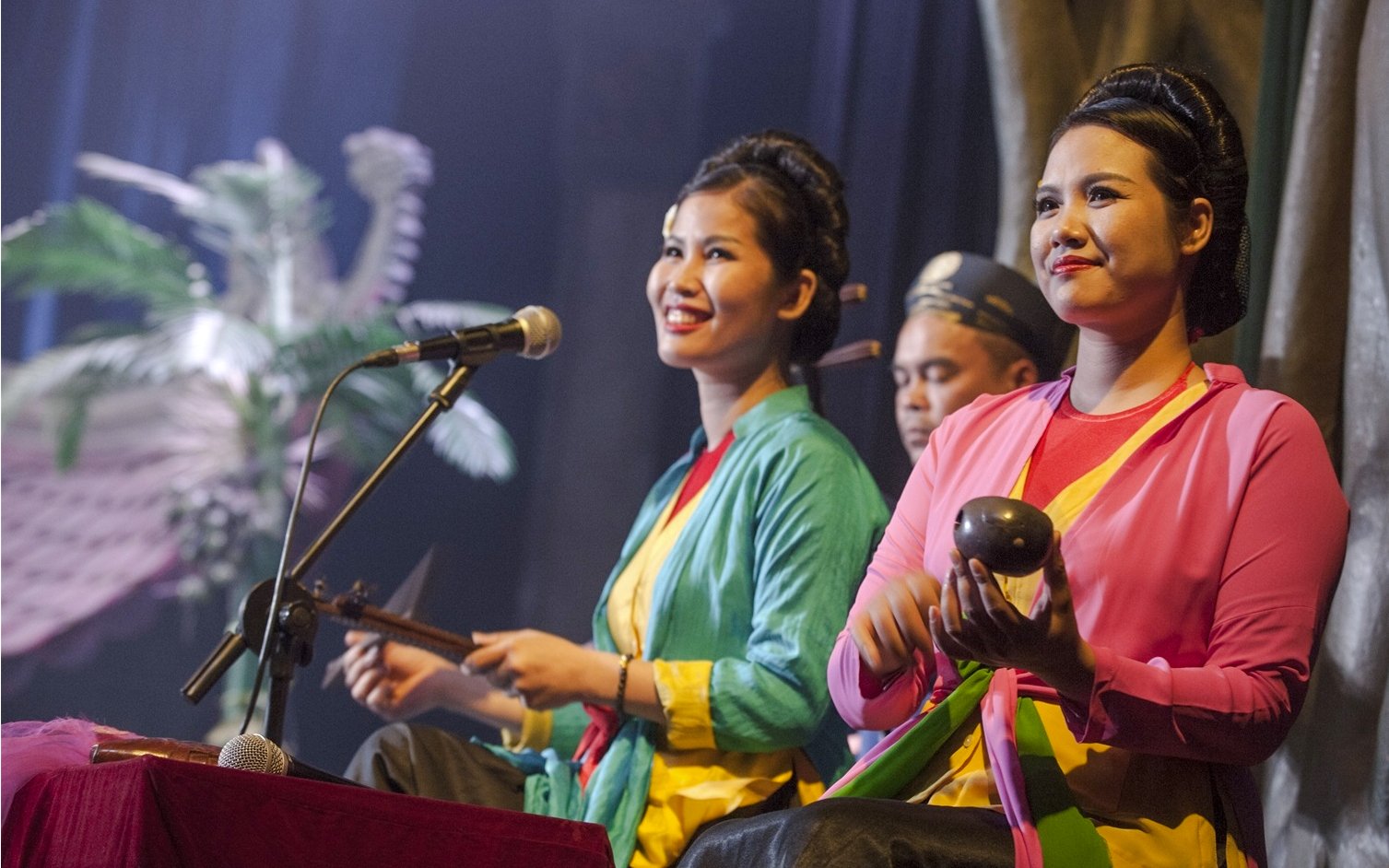 Performers at Thang Long Water Puppet Show playing traditional instruments.