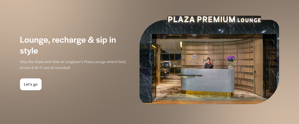 Langkawi Plaza Premium Lounge entrance with reception desk and staff.