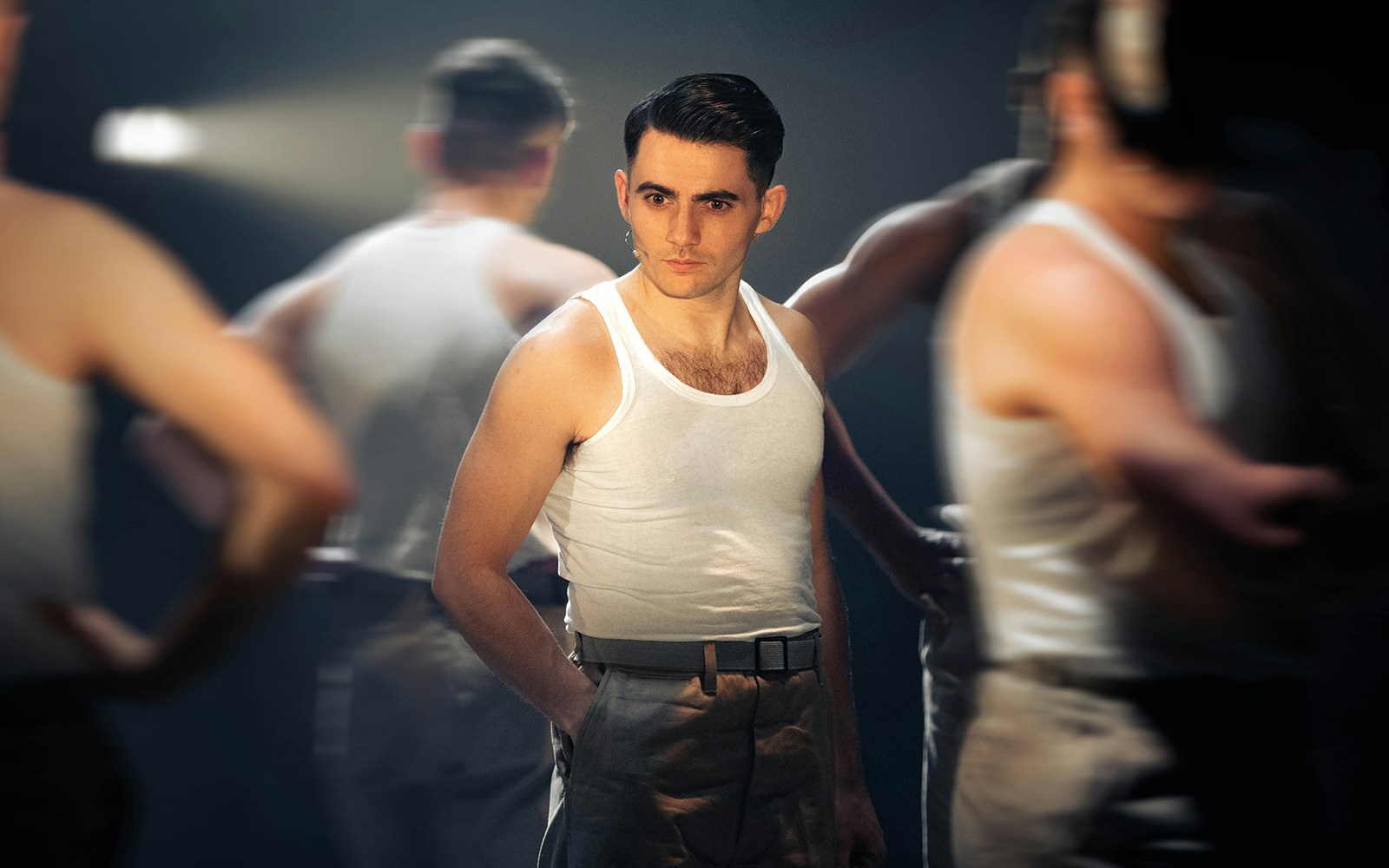 Performer in military attire on stage for "From Here To Eternity – The Musical.