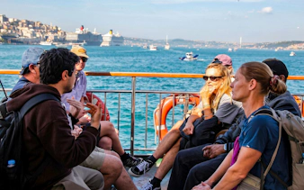 Group of people enjoying a boat tour on the Bosphorus in Istanbul.