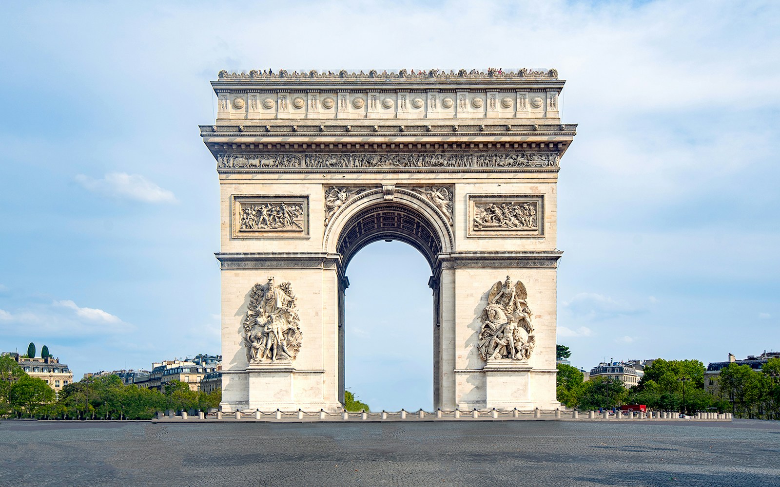Arc de Triomphe rooftop view overlooking Paris cityscape.