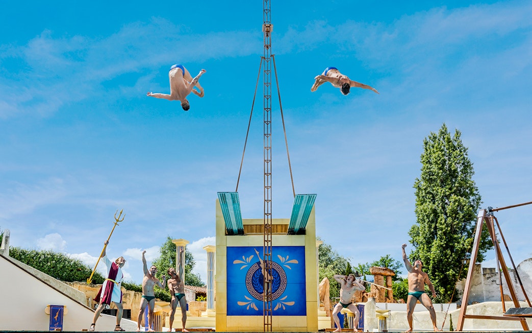 Performers diving at Astérix Park show in France.