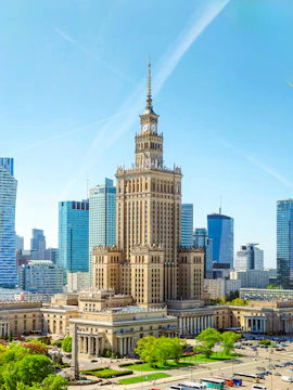 Palace of Culture and Science in Warsaw with surrounding skyscrapers.