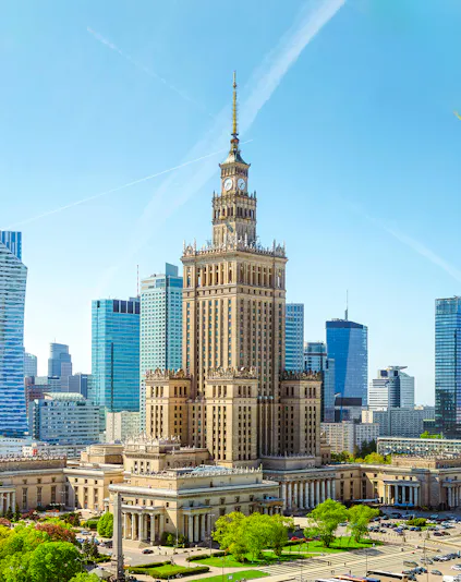 Palace of Culture and Science in Warsaw with surrounding skyscrapers.