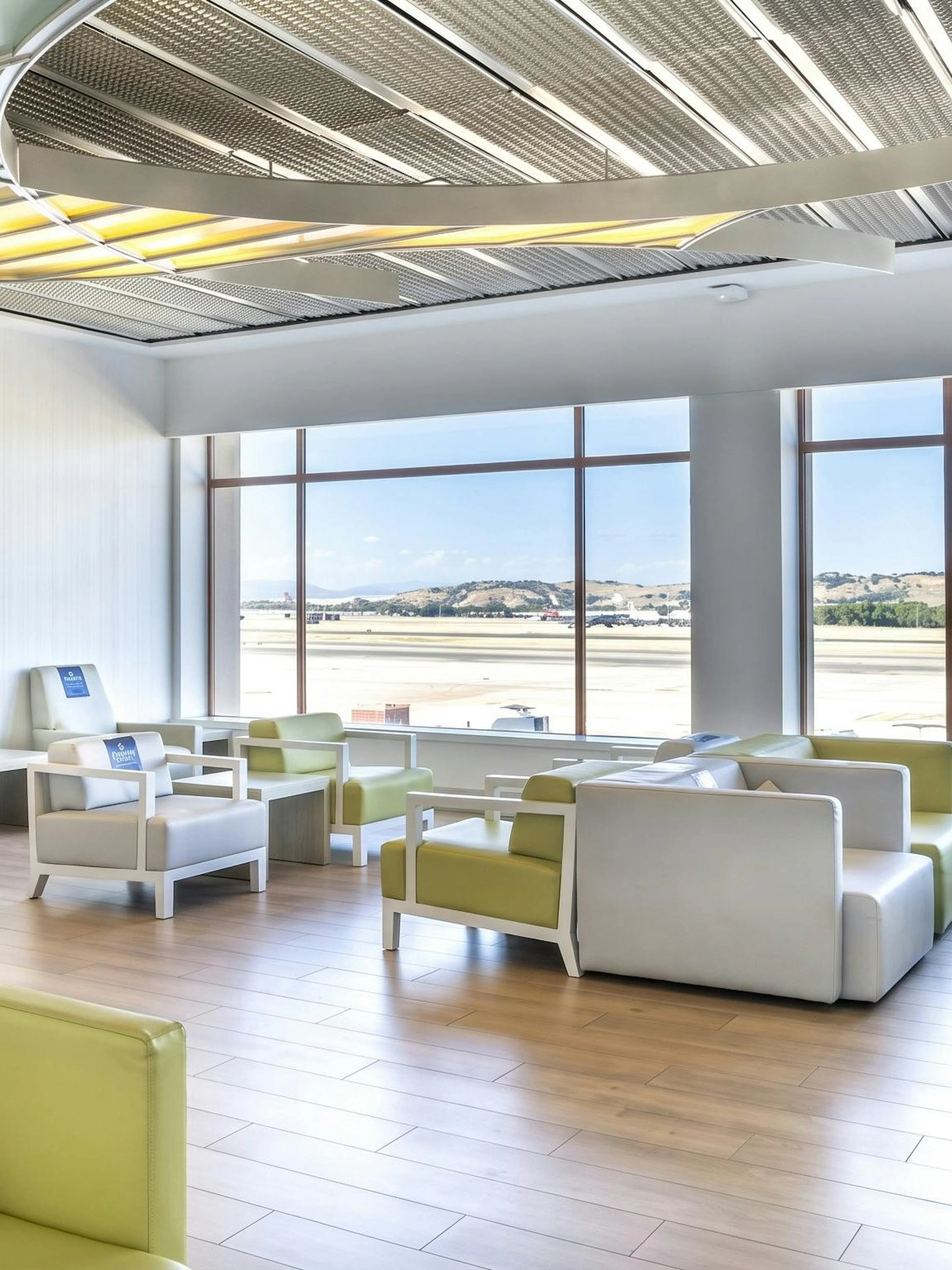 Sala VIP lounge seating area with runway view at Adolfo Suarez-Barajas Airport, Terminal 2, Madrid.