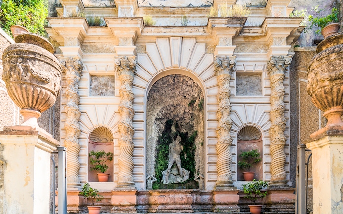 Villa d’Este ornate fountain with intricate columns and statues in Tivoli, Italy.