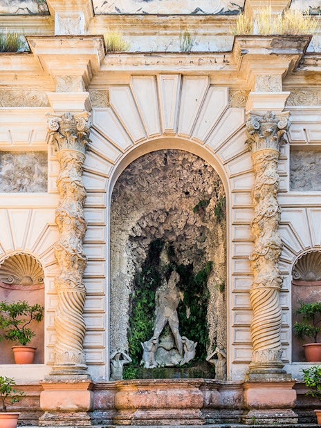 Villa d’Este ornate fountain with intricate columns and statues in Tivoli, Italy.