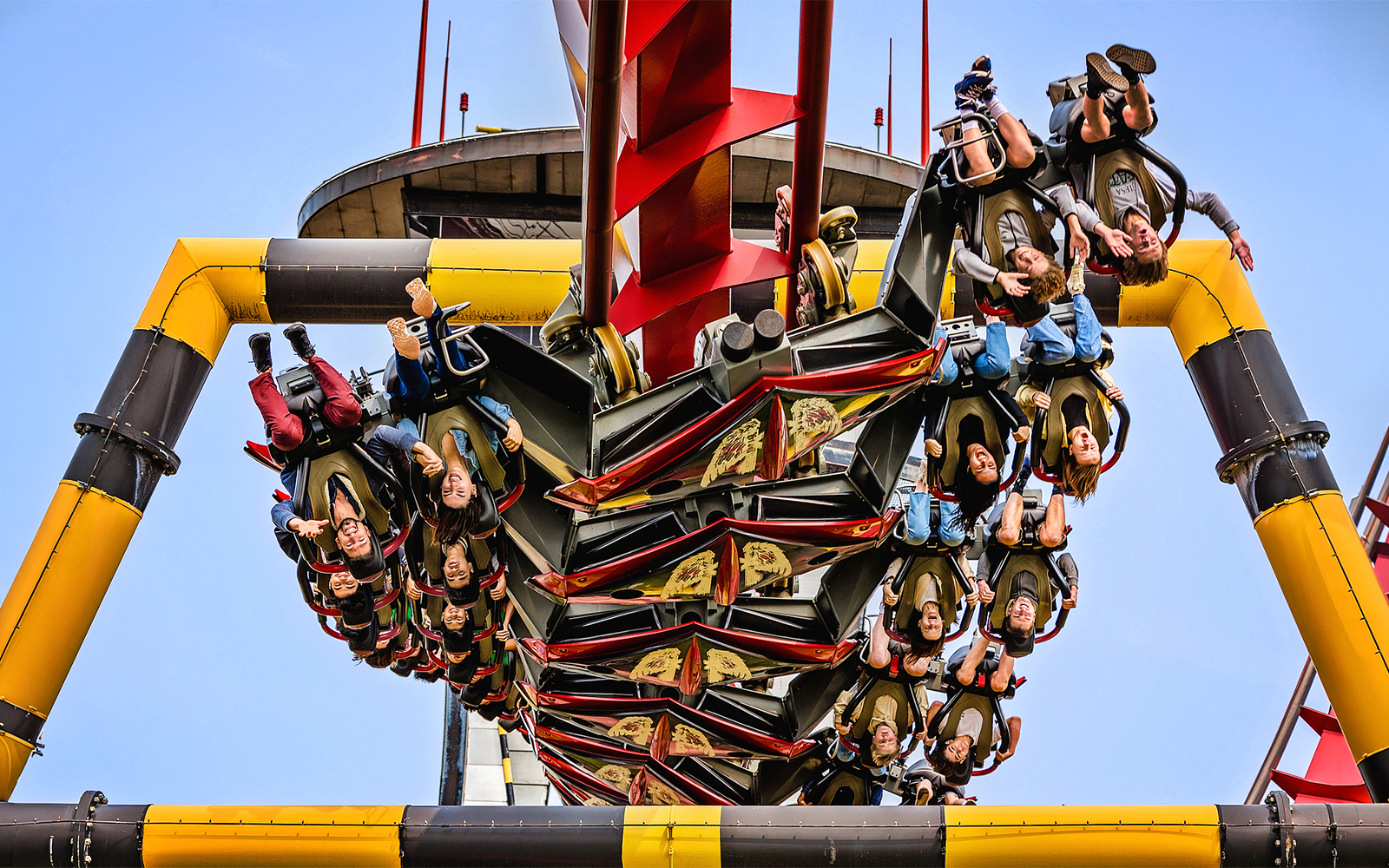Riders upside down on X Flight roller coaster at Six Flags Great America.
