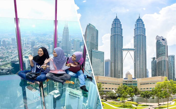 Visitors enjoying the glass sky deck with a view of Kuala Lumpur skyline and Petronas Towers.