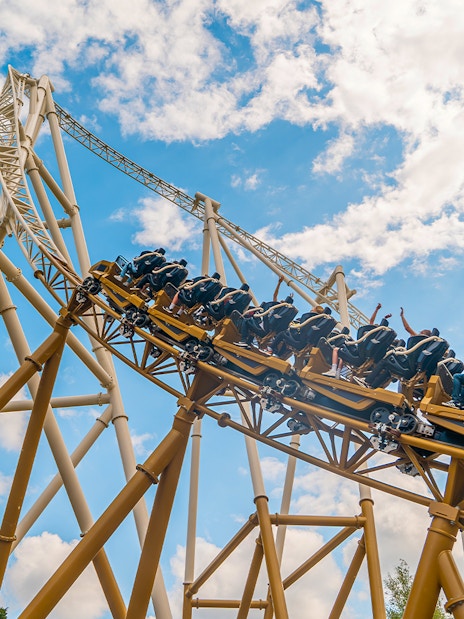 Roller coaster ascending steep track at Rides Wide, Thorpe Park.