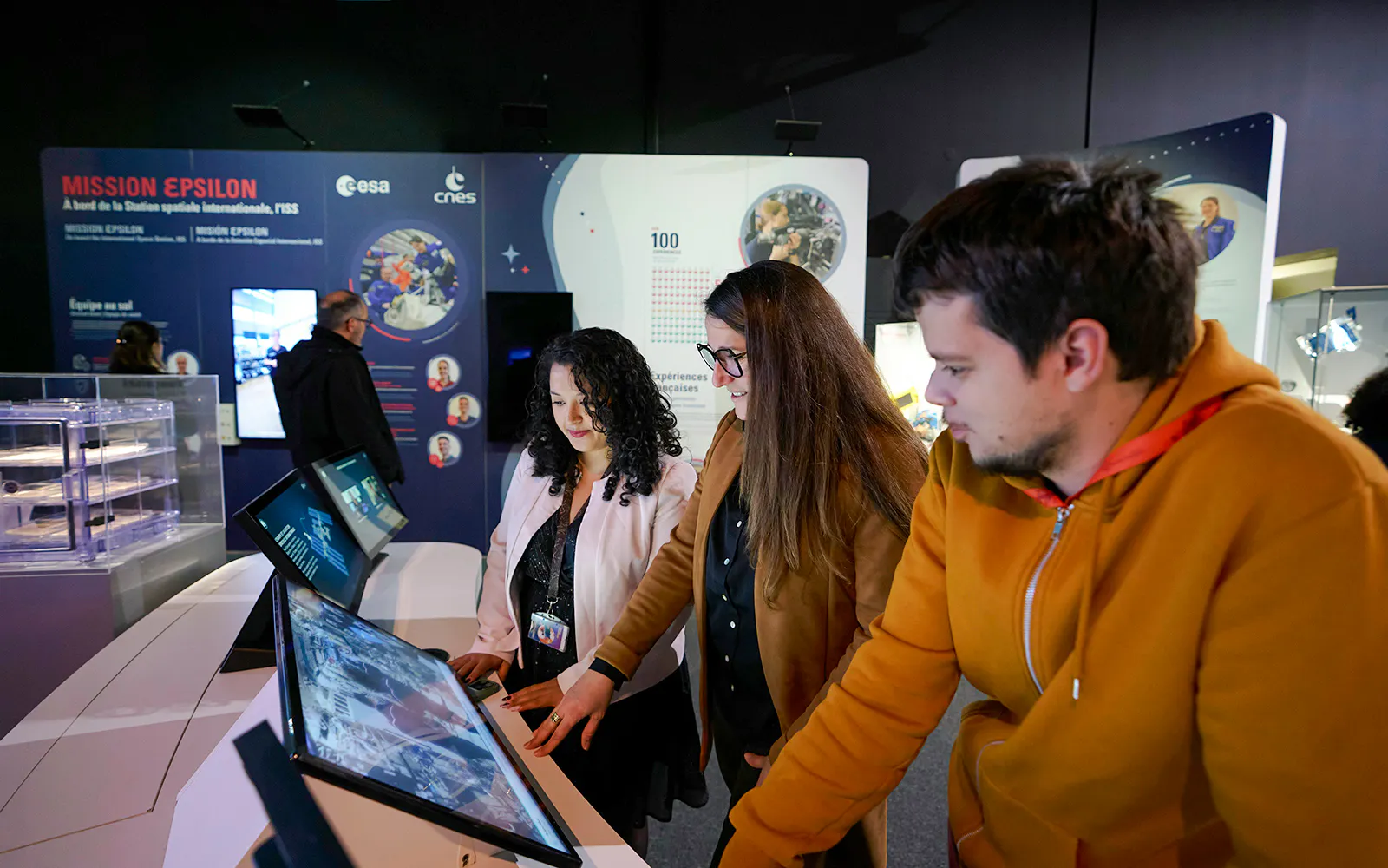 Visitors interacting with exhibits at Cité de l’Espace, France.