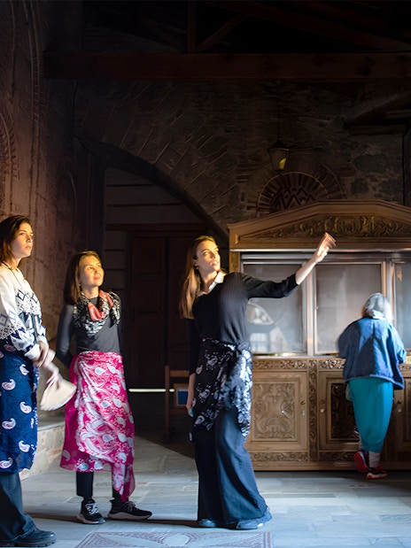 Visitors inside a Meteora monastery during a 1-day tour from Athens by train.