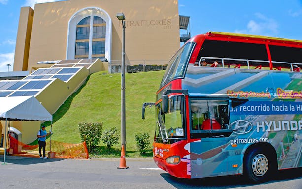 Open-top tour bus at Miraflores Locks, Panama City Hop-On-Hop-Off Tour.
