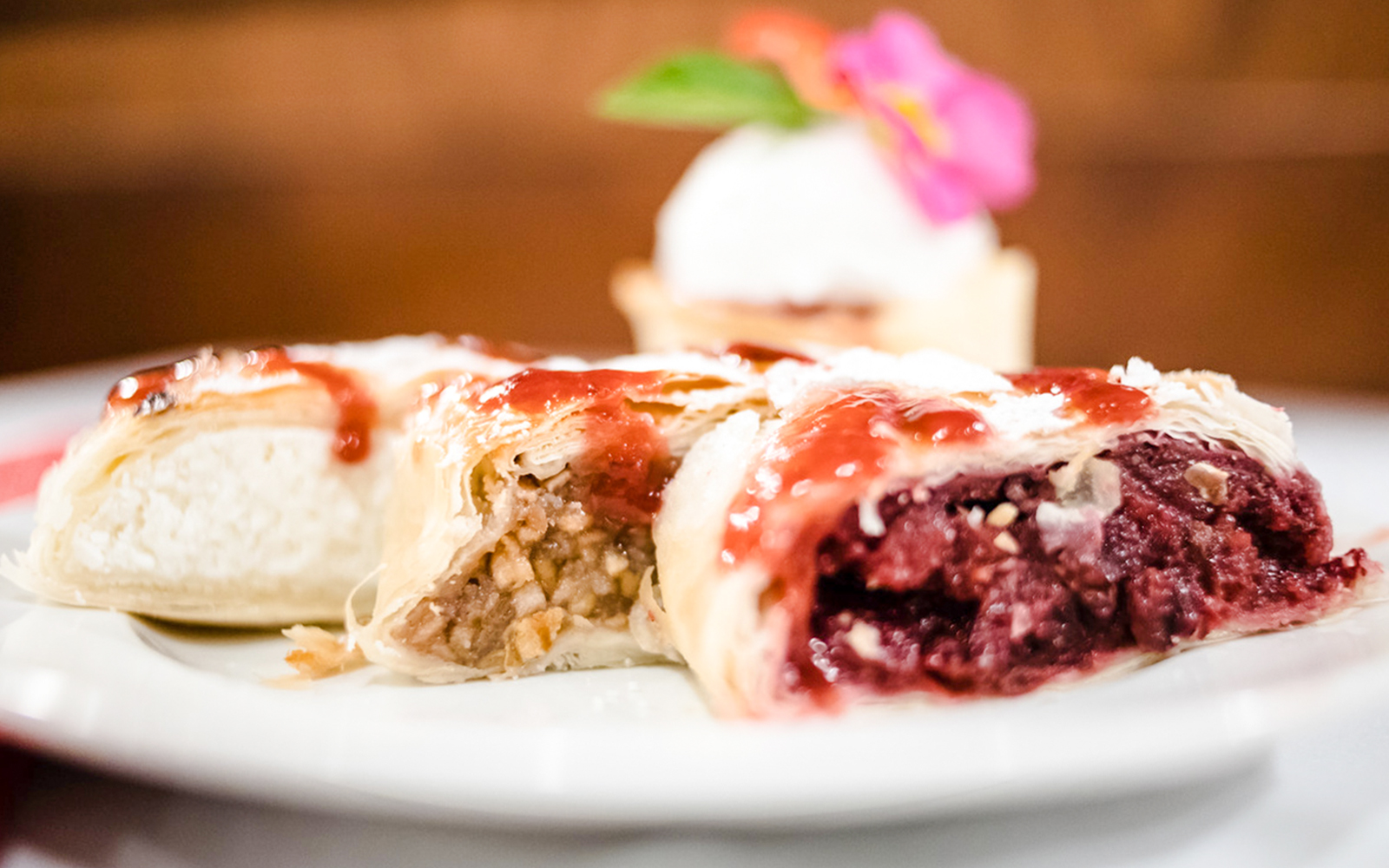 Hungarian pastries with fruit and nut fillings on a plate, Budapest Danube River cruise.