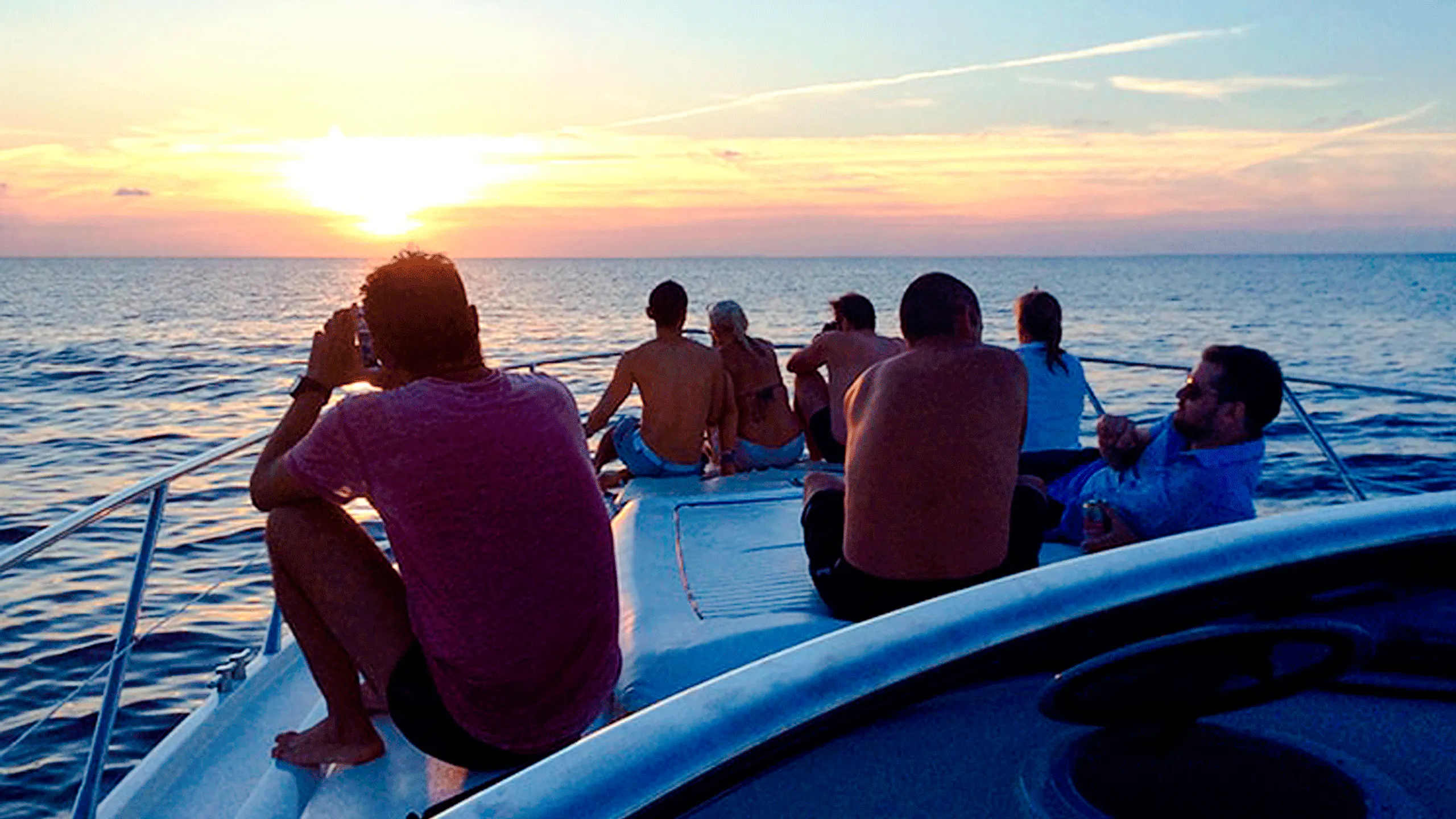 People enjoying a sunset boat party on Cartagena's Bay.