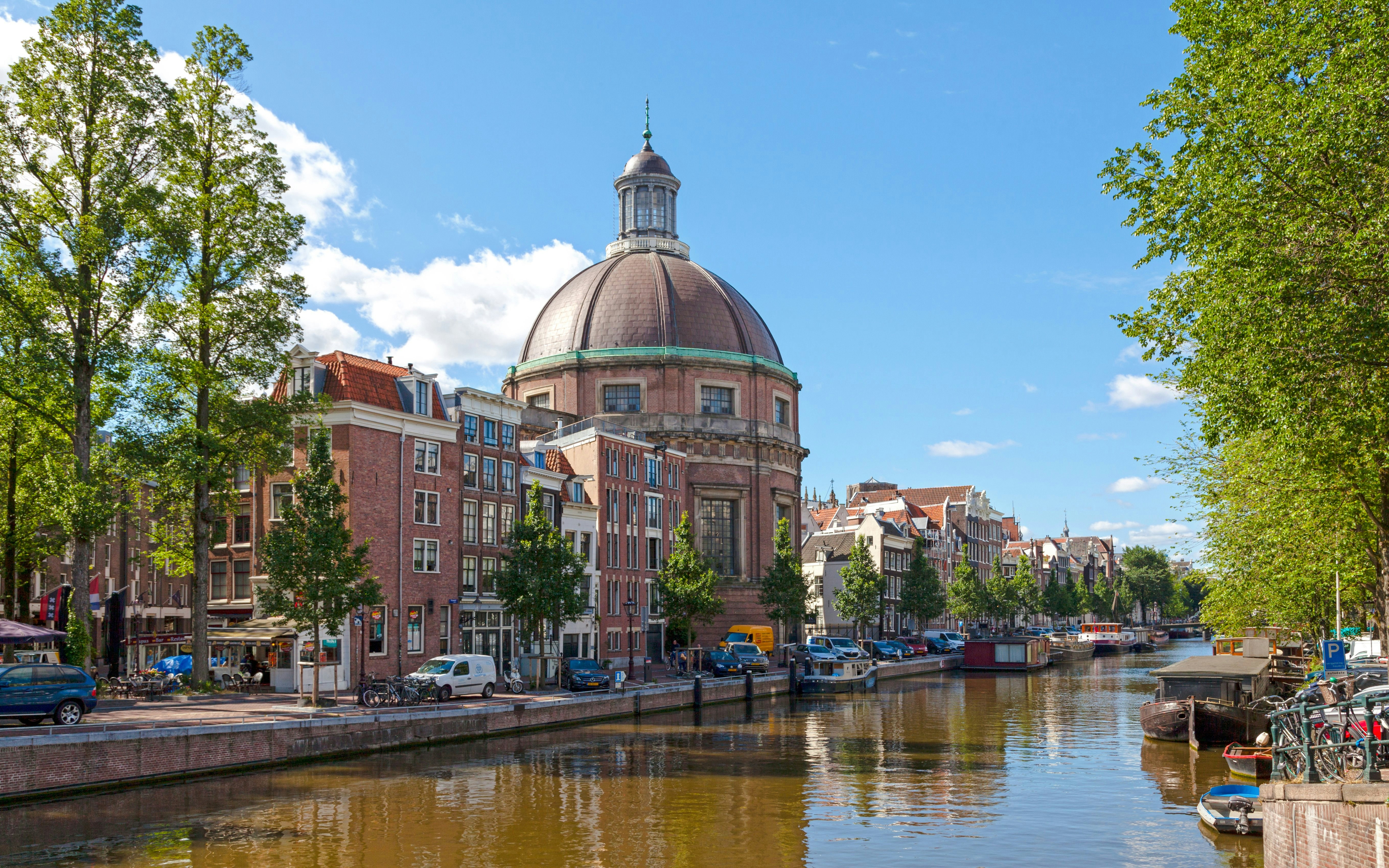 Ronde Lutherse Kerk dome and canal view in Amsterdam.