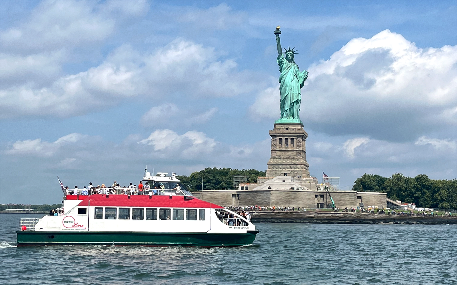 View of the Liberty Super Express passing by Statue of Liberty