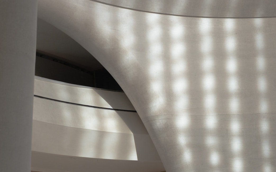 Curved architectural detail of Zayed National Museum exterior in Abu Dhabi.