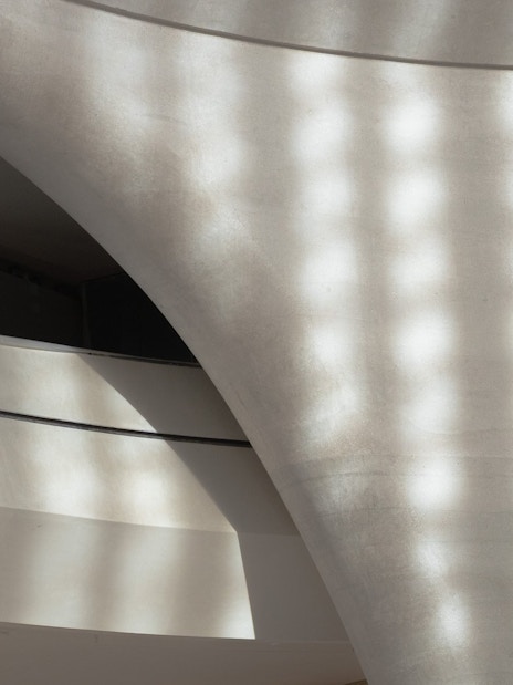 Curved architectural detail of Zayed National Museum exterior in Abu Dhabi.