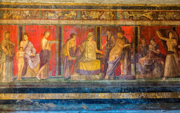Fresco in Room 5 of the Villa of the Mysteries, Pompeii, depicting a Dionysian ritual scene.