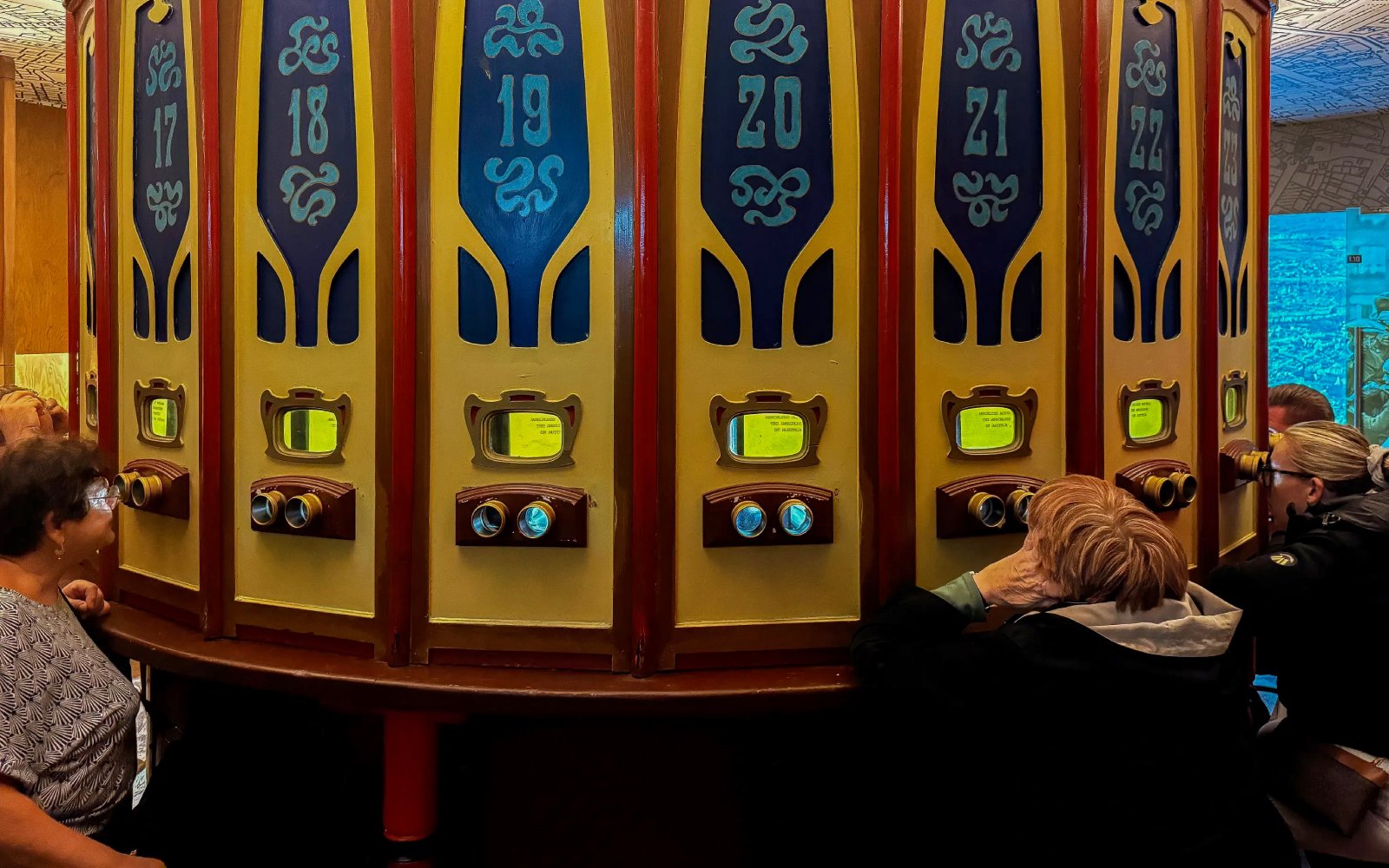 Visitors viewing exhibits through vintage stereoscopes at Oskar Schindler’s Factory.