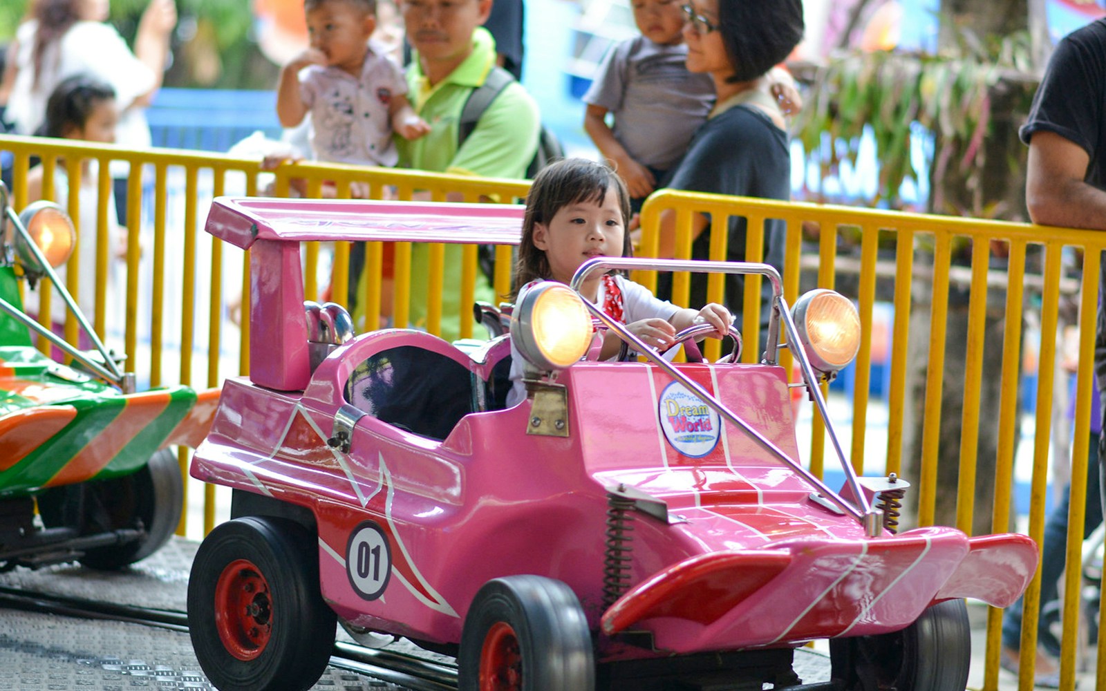 Dream World amusement park entrance with colorful castle and round trip transfers in Bangkok.