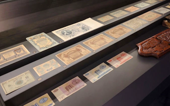 Banknotes displayed at the Museum of Numismatics in Baku during a guided tour.