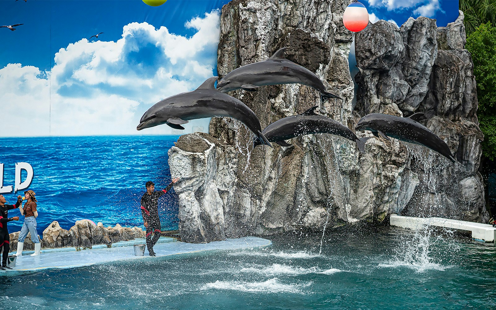 Safari World Bangkok entrance with visitors and animal sculptures, highlighting tour experience with round-trip transfers.