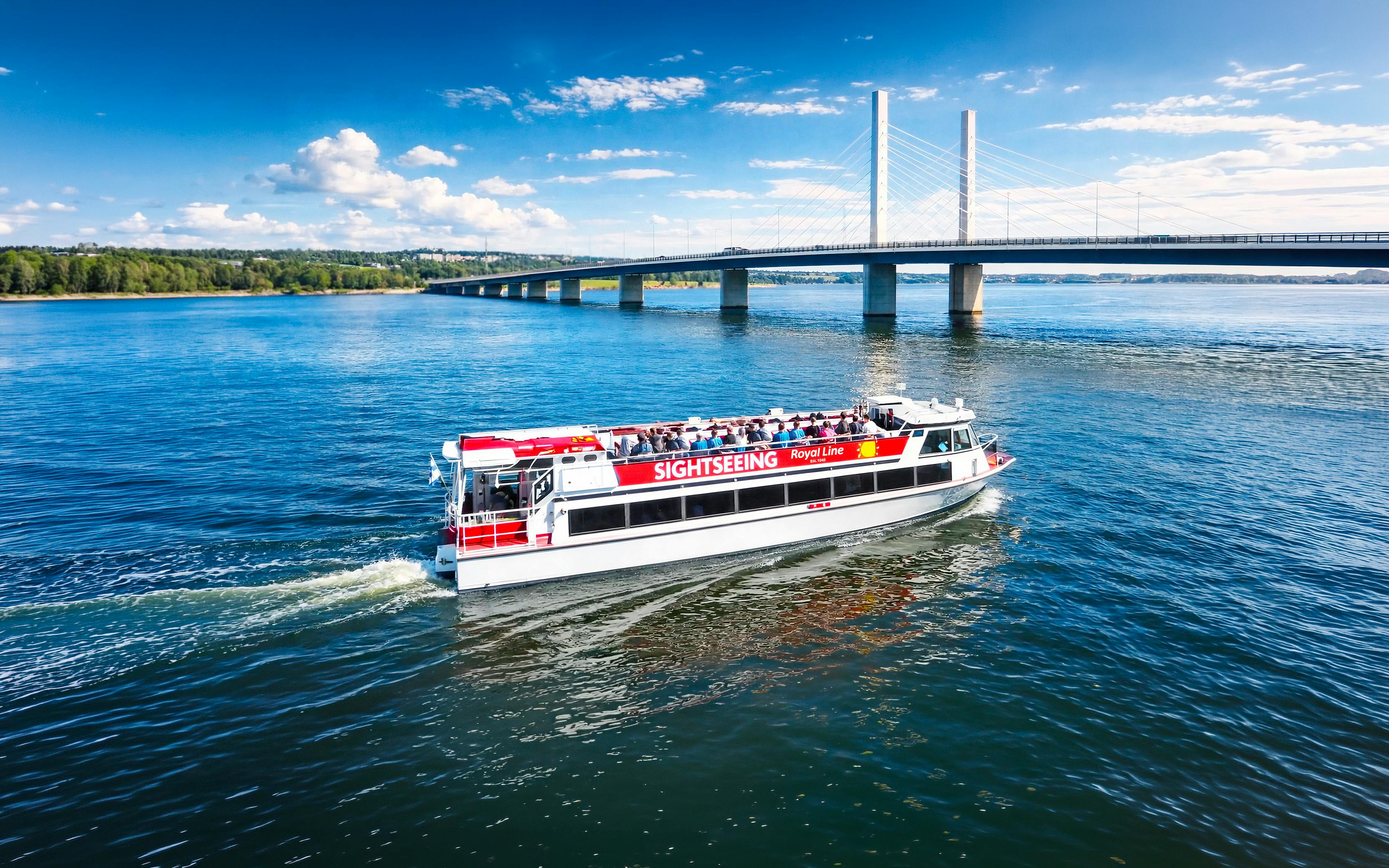 Sightseeing cruise boat near Kruununvuorensilta bridge, Finland.