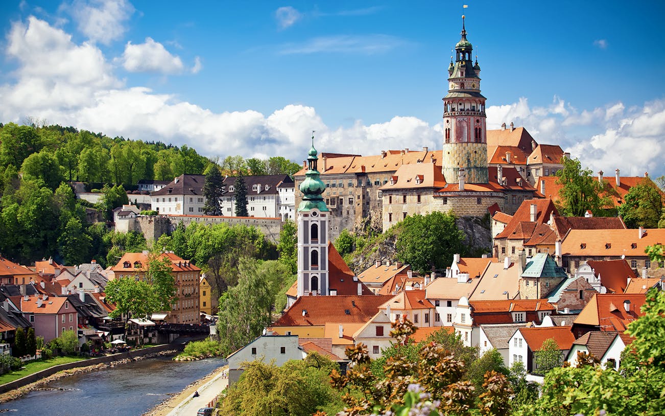 Český Krumlov Castle with red rooftops and tower, Czech Republic.