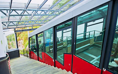 Funicular at Mount Floyen station in Bergen, Norway, with passengers inside.