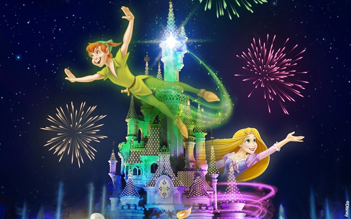 Fireworks over a castle with animated characters flying, Disneyland Paris.