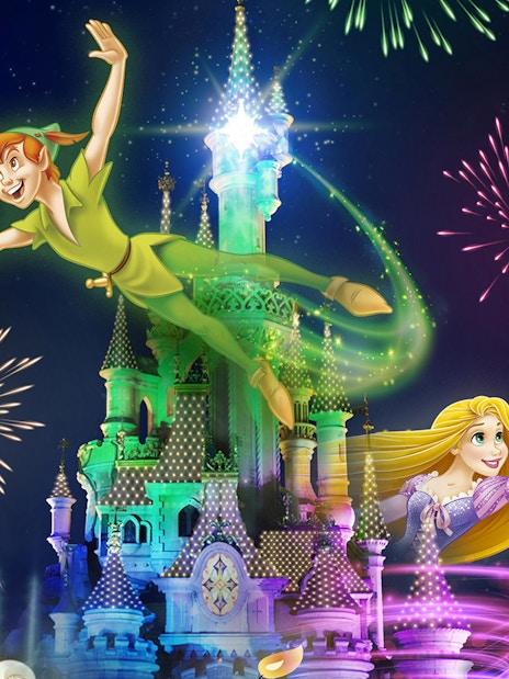 Fireworks over a castle with animated characters flying, Disneyland Paris.