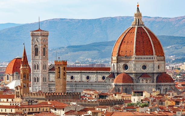 Aerial view of Florence Cathedral with its iconic dome and bell tower.