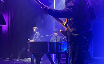 Musicians performing on stage during Piano Man tribute show in Nevada.