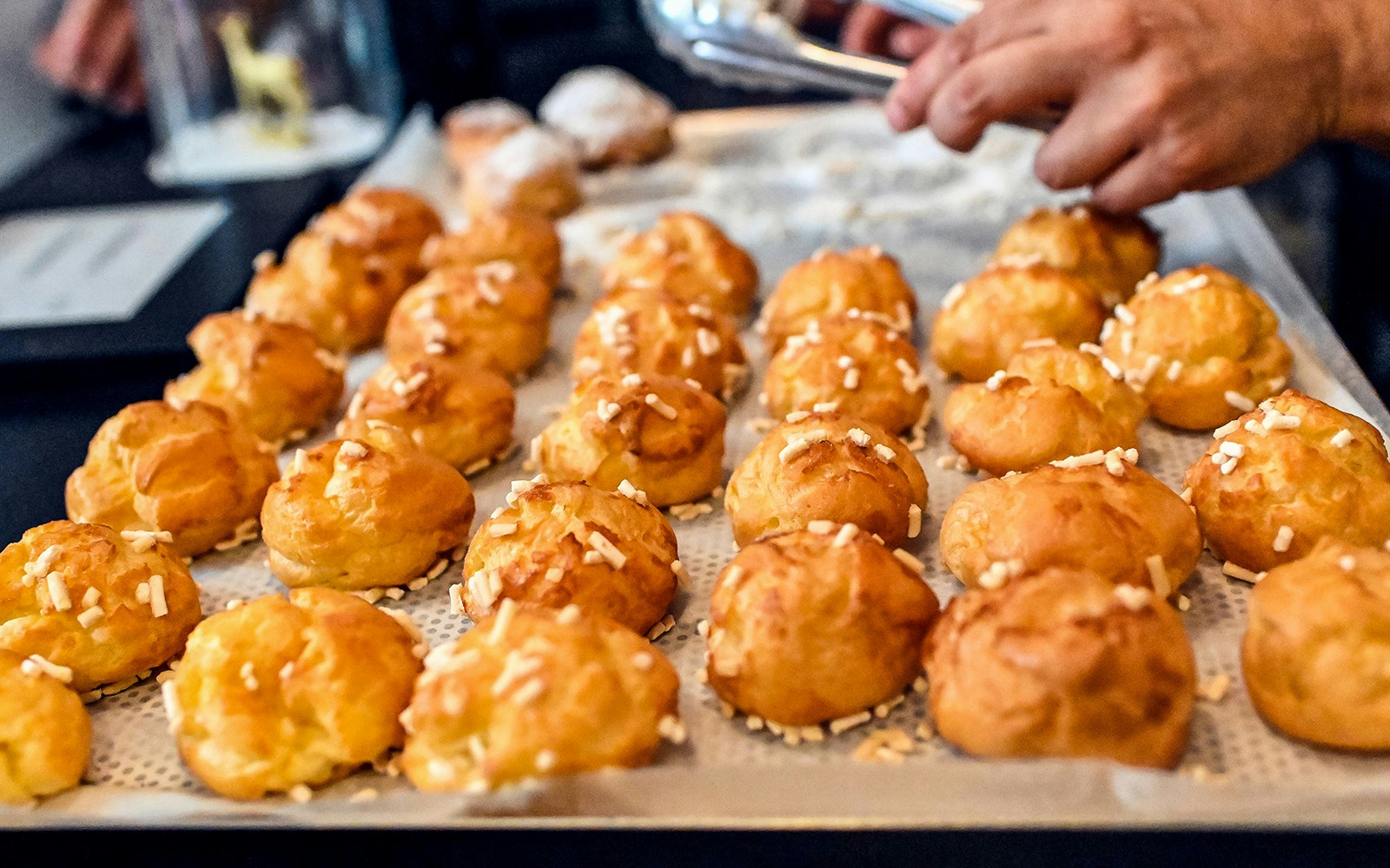 Street vendor selling Epic French Puffs, guided Walking food tour, Montmartre Paris