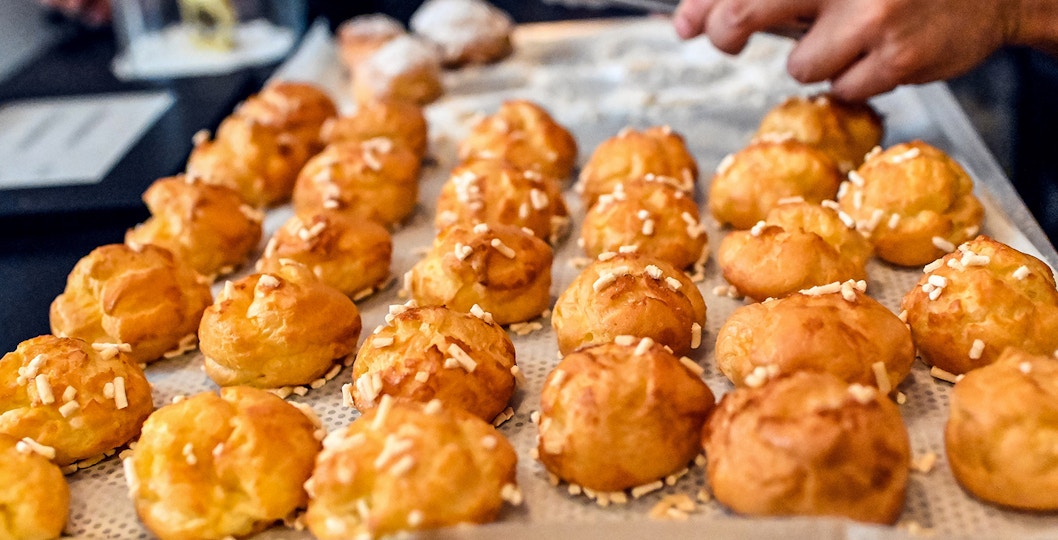 Street vendor selling Epic French Puffs, guided Walking food tour, Montmartre Paris